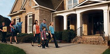 Family_And_Crew_Walking_To_House.jpg?width=370&height=184&ext=